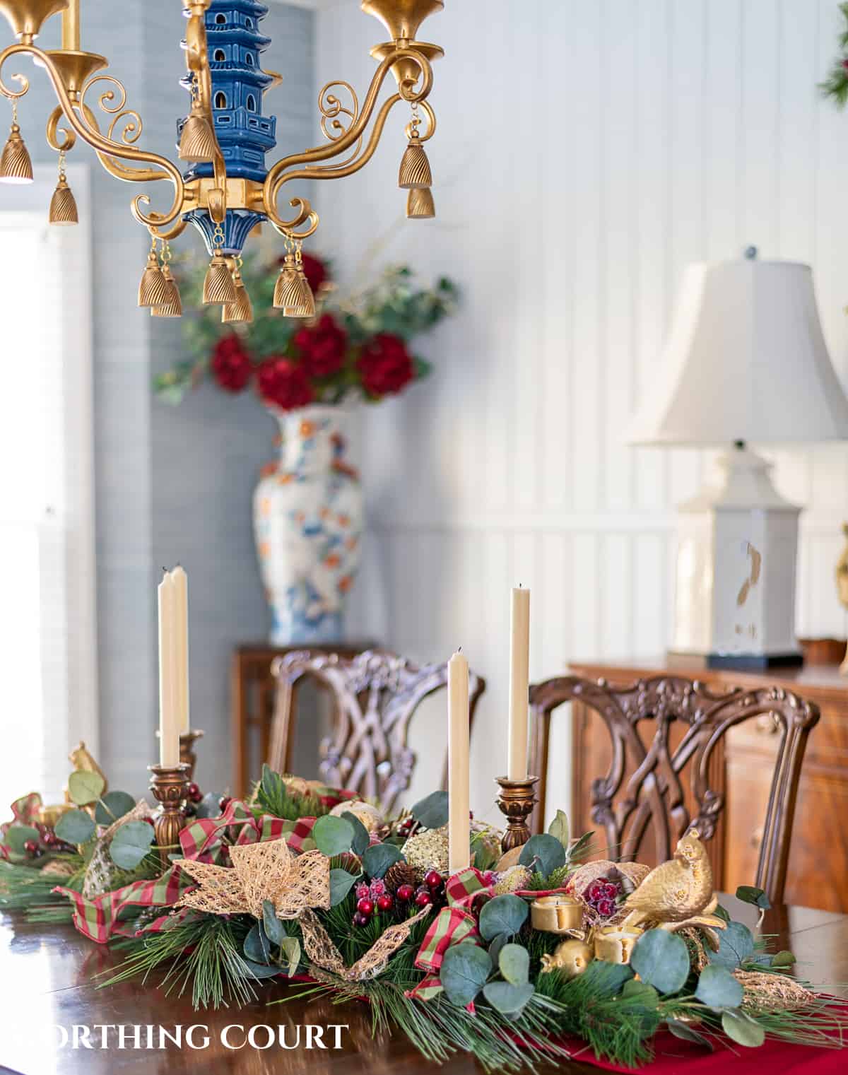 An elegant, but easy Christmas centerpiece made with faux greenery and sugared fruit swags. Includes green, burgundy and gold ribbon, gold candlesticks and white candles.