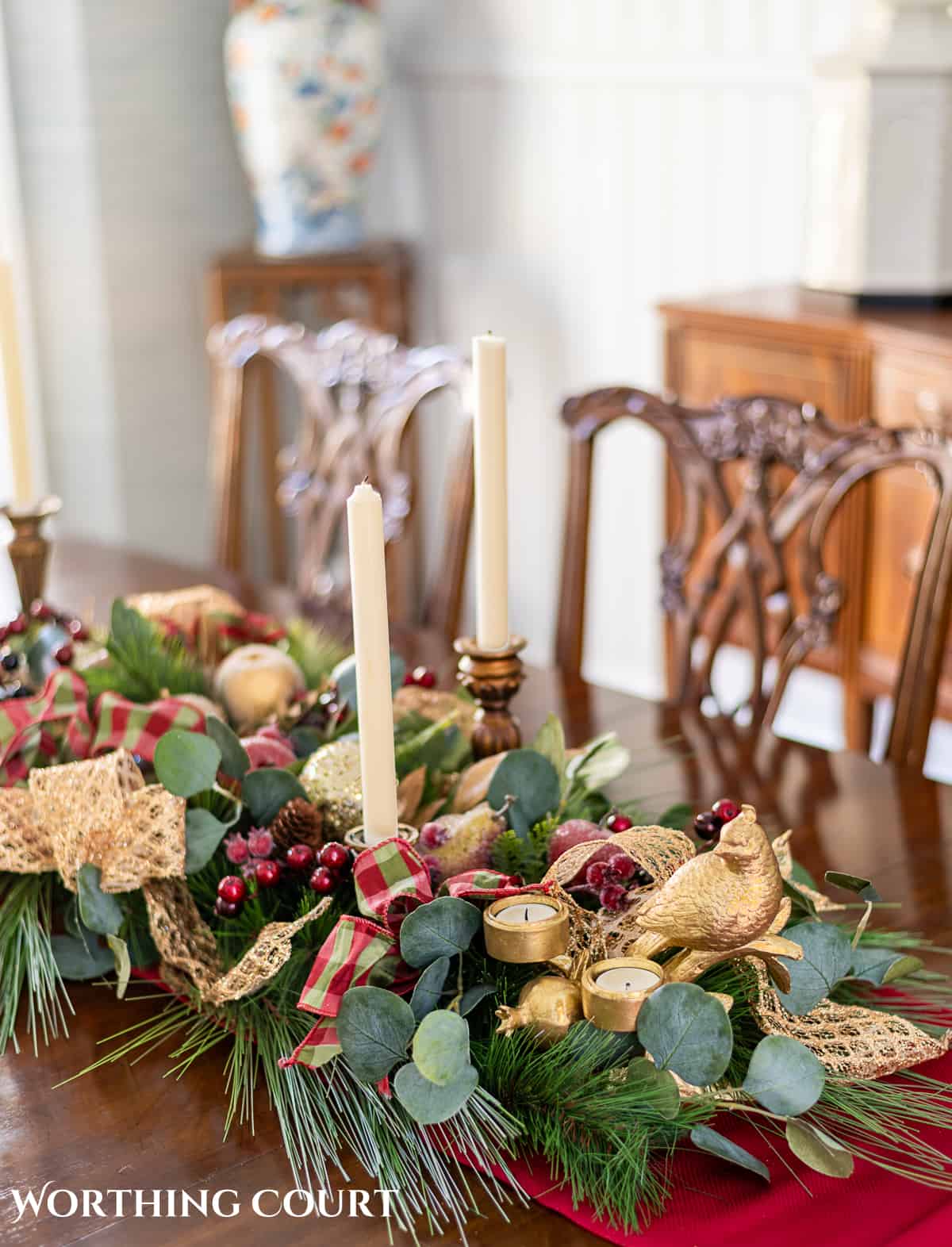 An elegant, but easy Christmas centerpiece made with faux greenery and sugared fruit swags. Includes green, burgundy and gold ribbon, gold candlesticks and white candles.