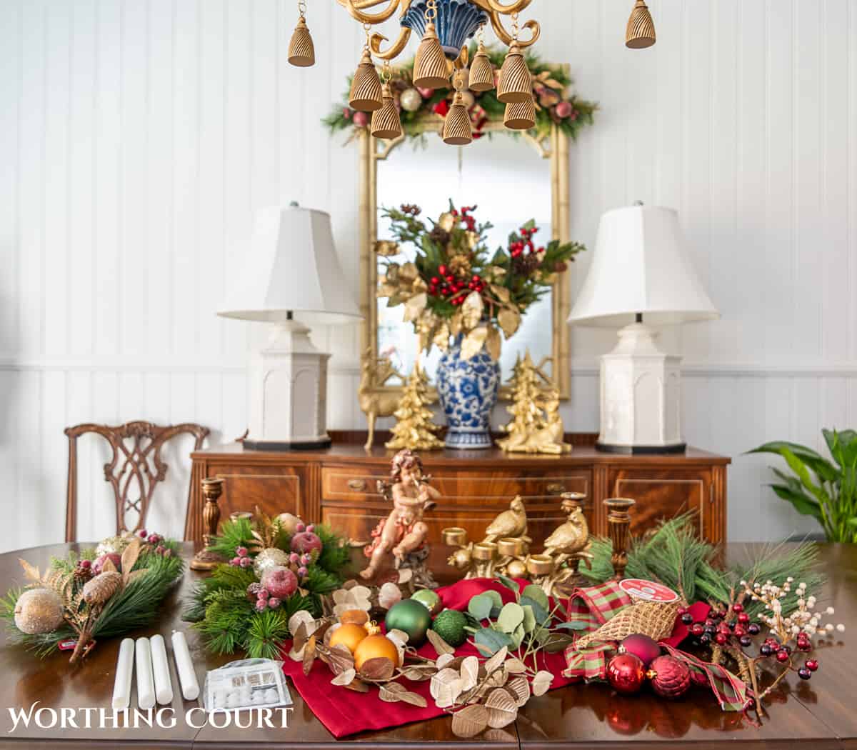 An elegant, but easy Christmas centerpiece made with faux greenery and sugared fruit swags. Includes green, burgundy and gold ribbon, gold candlesticks and white candles.