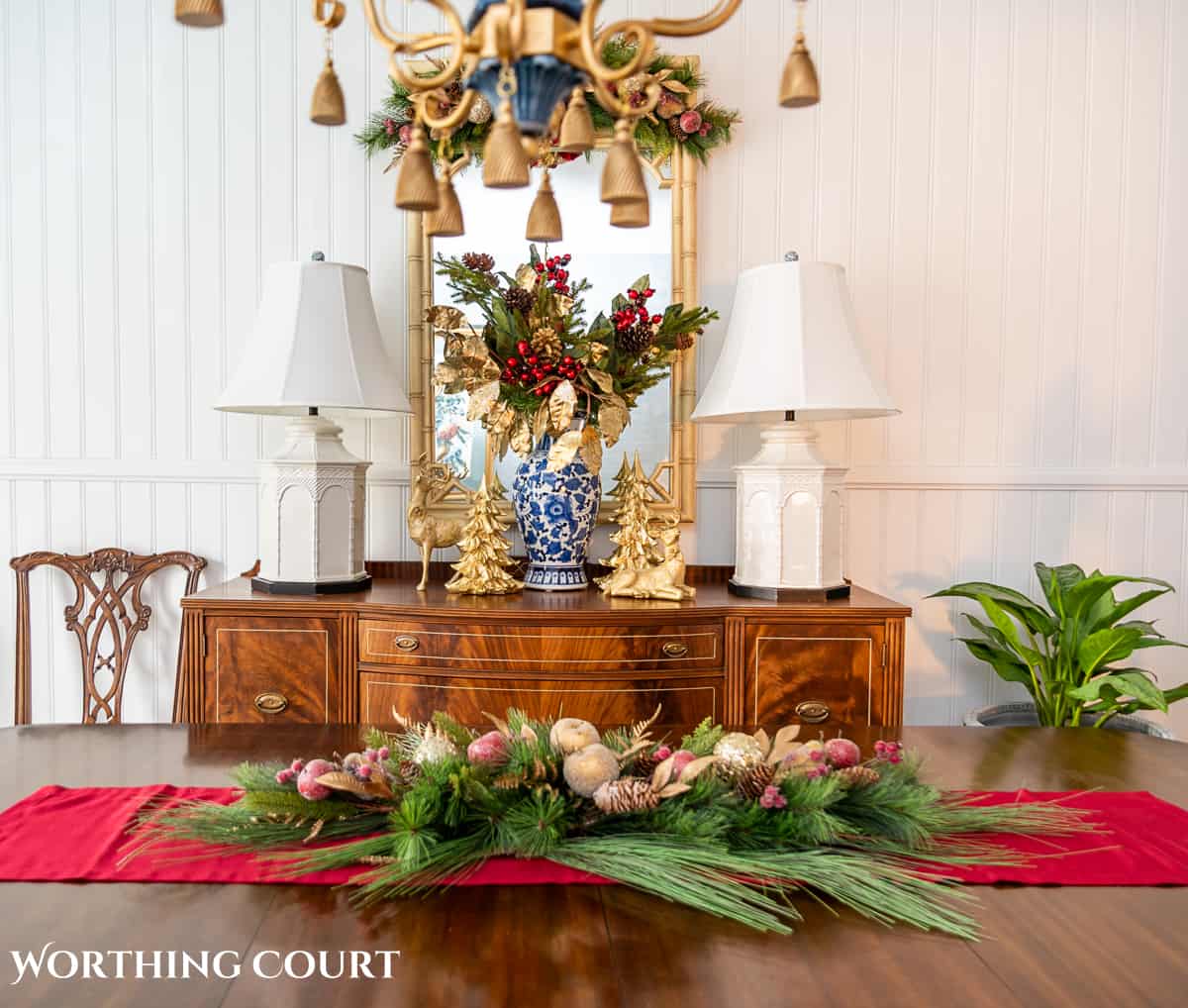 An elegant, but easy Christmas centerpiece made with faux greenery and sugared fruit swags. Includes green, burgundy and gold ribbon, gold candlesticks and white candles.