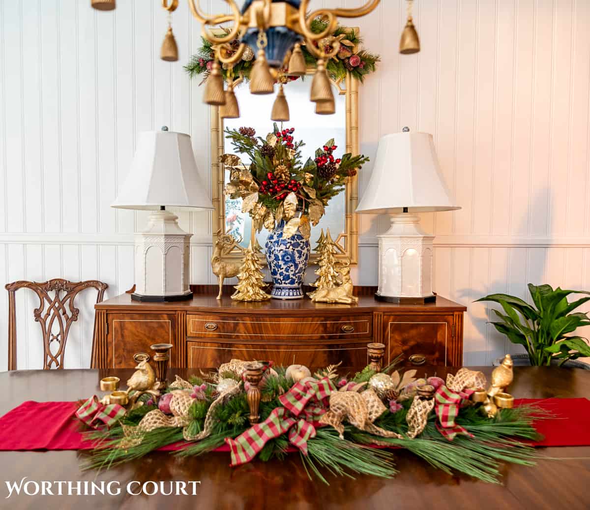 An elegant, but easy Christmas centerpiece made with faux greenery and sugared fruit swags. Includes green, burgundy and gold ribbon, gold candlesticks and white candles.