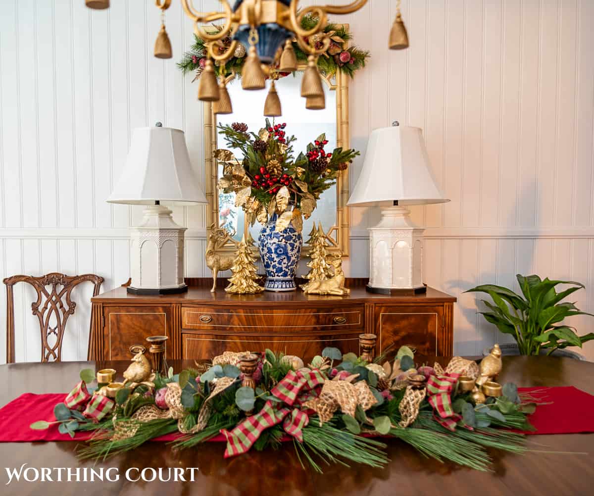 An elegant, but easy Christmas centerpiece made with faux greenery and sugared fruit swags. Includes green, burgundy and gold ribbon, gold candlesticks and white candles.