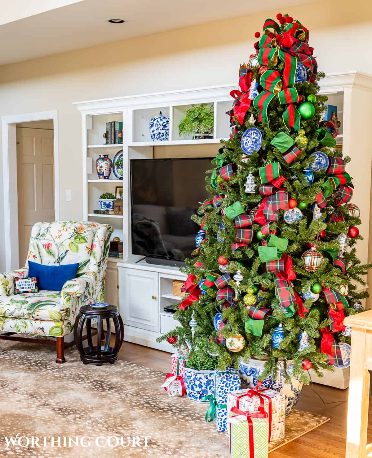 Christmas tree with traditional decorations in red, green, blue and white in a chinoiserie planters