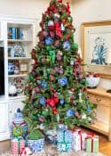Christmas tree with traditional decorations in red, green, blue and white in a chinoiserie planters