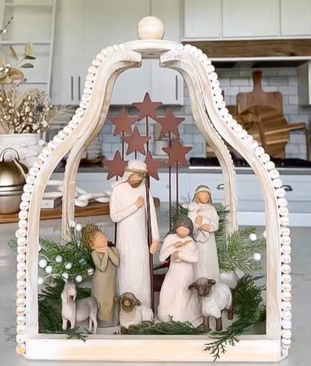 natural colored nativity set displayed in an open lantern