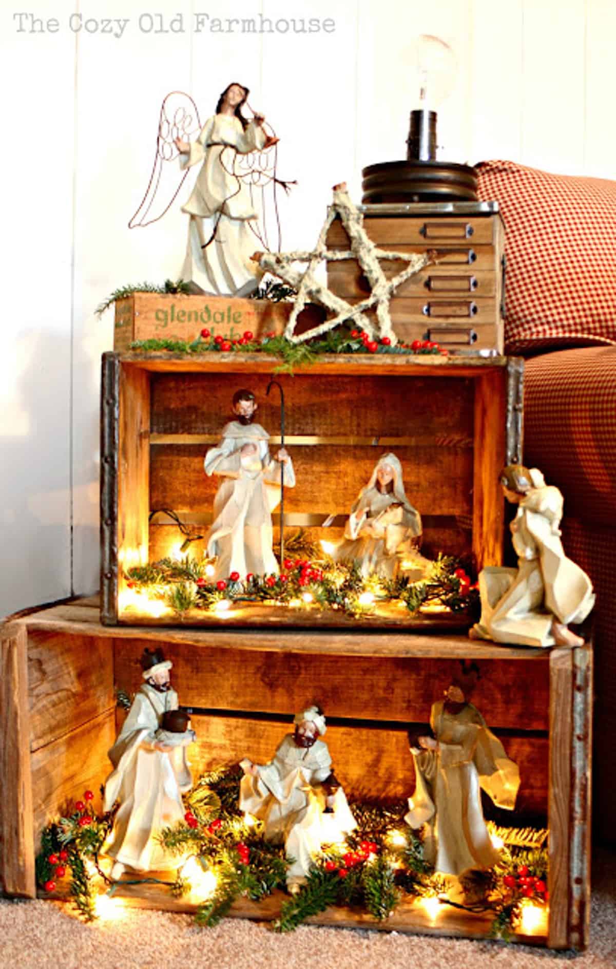 nativity scene figurines displayed in tiered wood boxes