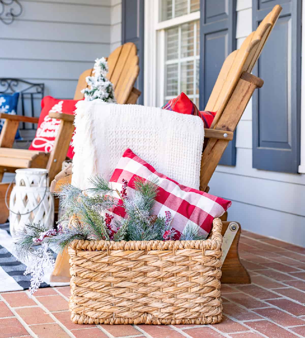 white blanket draped over the arm of a wooden outdoor chair