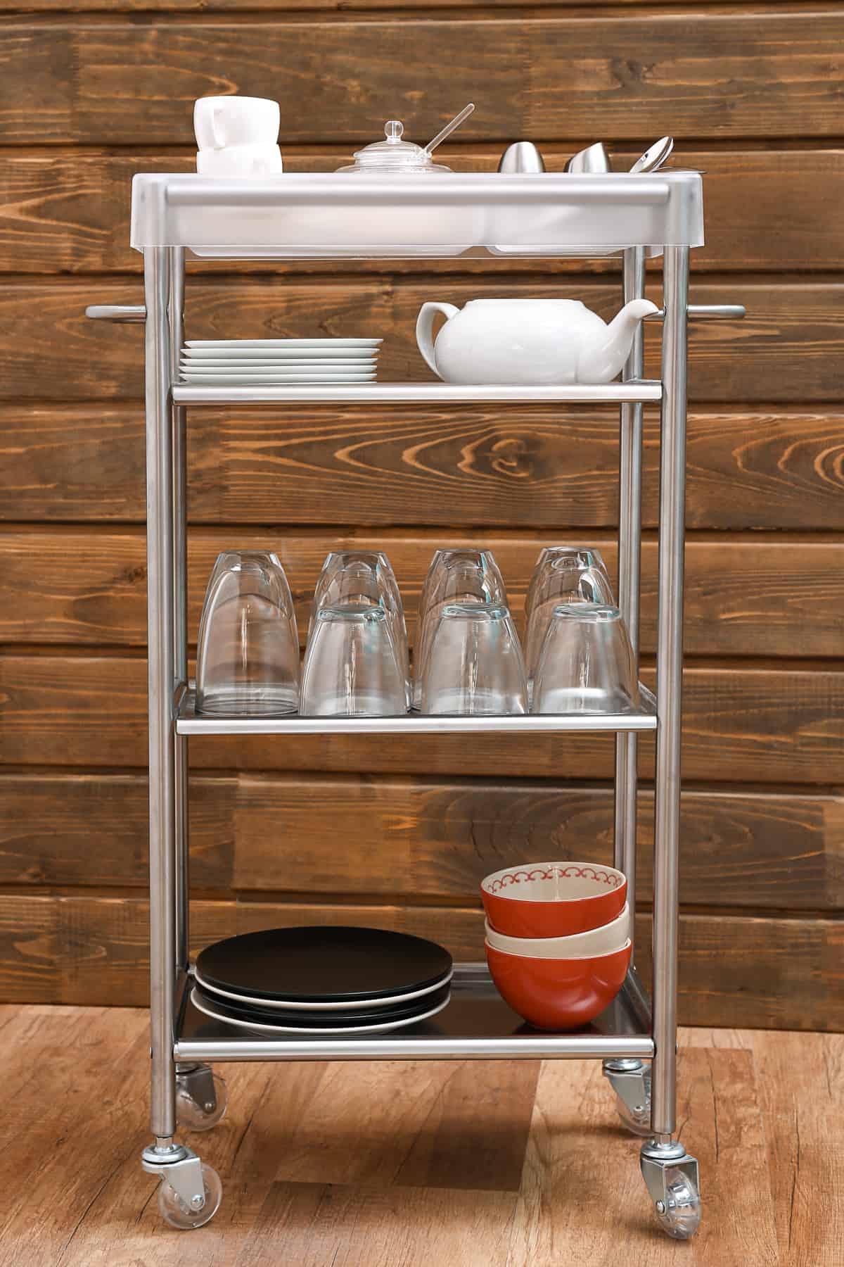 rolling metal utility cart filled with kitchen items for extra storage