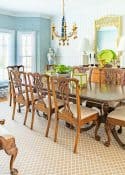 stylish dining room with new trad decor including chippendale style table and chairs, neutral rug, pagoda chandelier and updated accessories.
