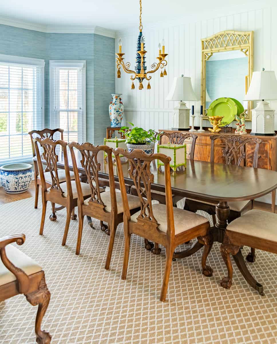 chippendale style chairs around a double pedestal table in a dining room decorated in new trad style