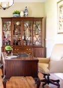 China cabinet in a home office filled with office type accessories - very on trend for 2024