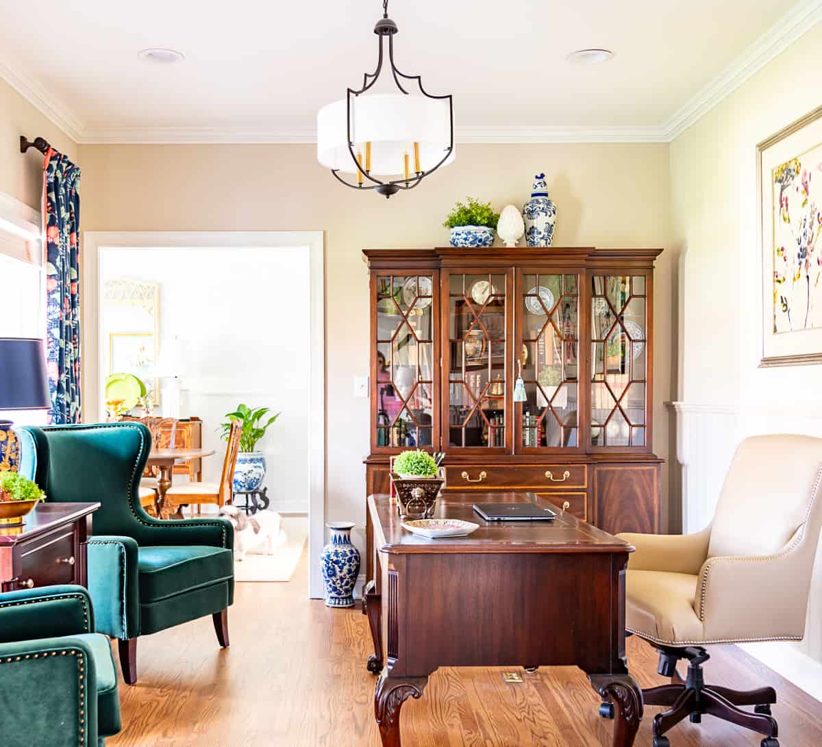 China cabinet in a home office filled with office type accessories - very on trend for 2024