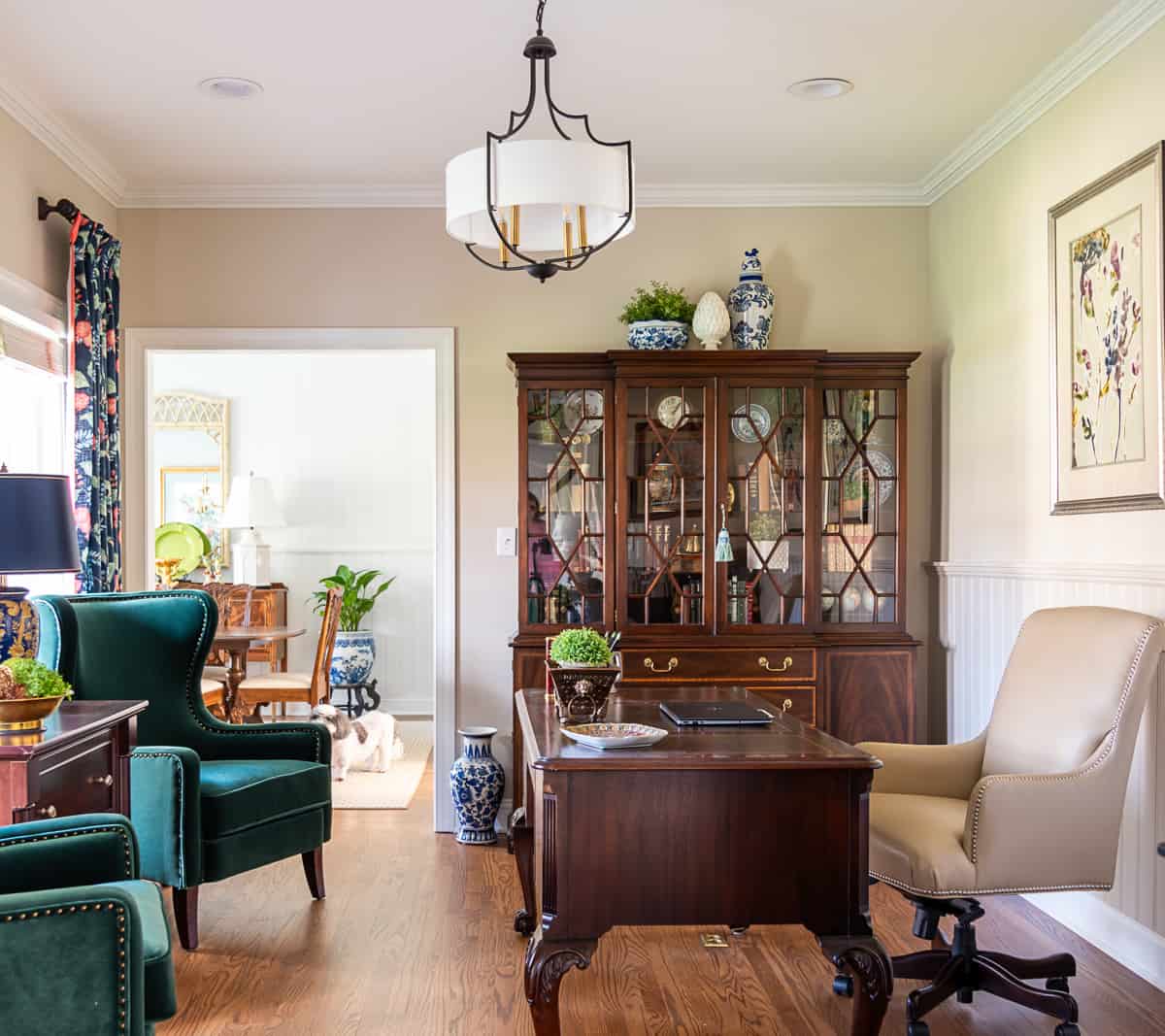 China cabinet in a home office filled with office type accessories - very on trend for 2024