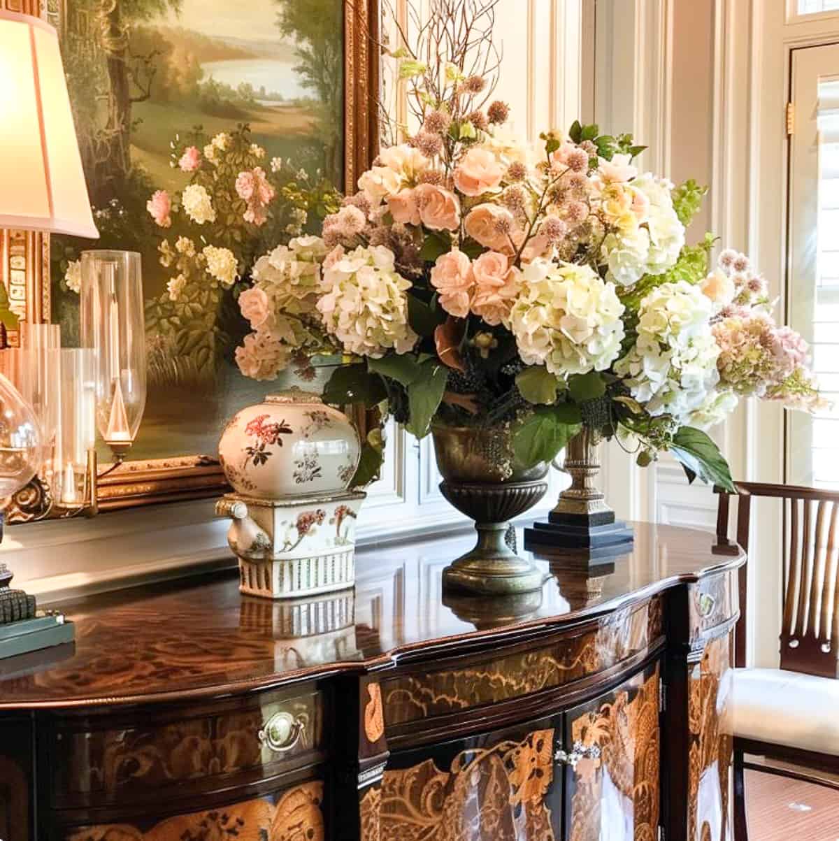 formal flower arrangment on a sideboard