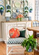 breakfast room with a large bay window decorated for summer