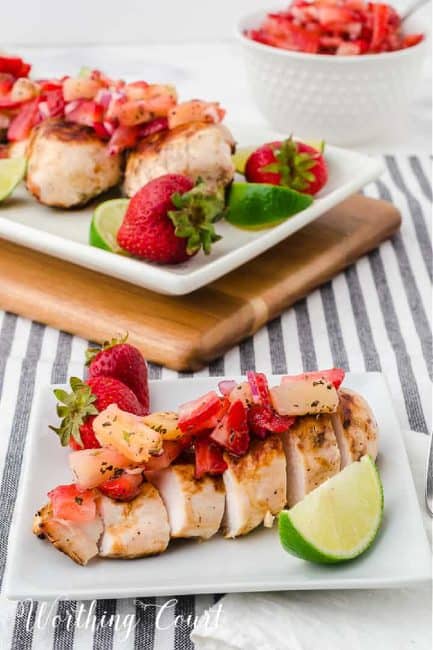 Sliced grilled chick breast topped with strawberry and pineapple salsa