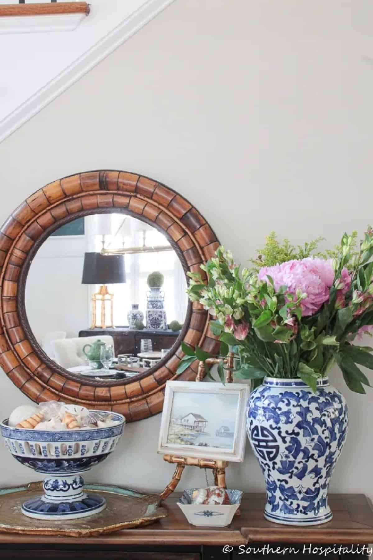 vignette with blue and white accessories and summer flowers