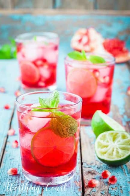 glasses of pink lemonade on a blue table