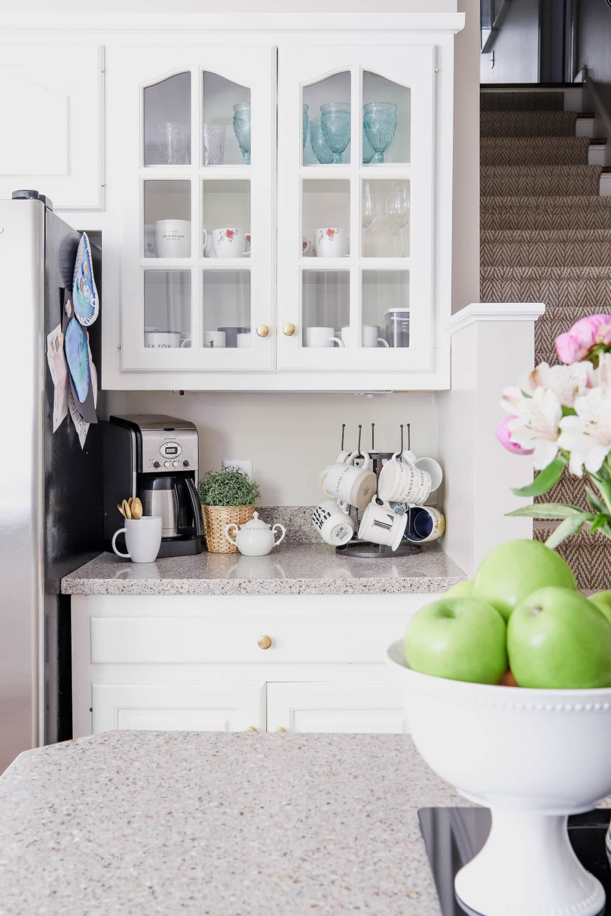 coffee bar setup in a kitchen with white cabinets