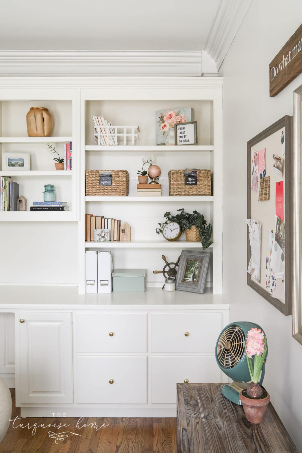 styled built-in white bookcases and cabinets