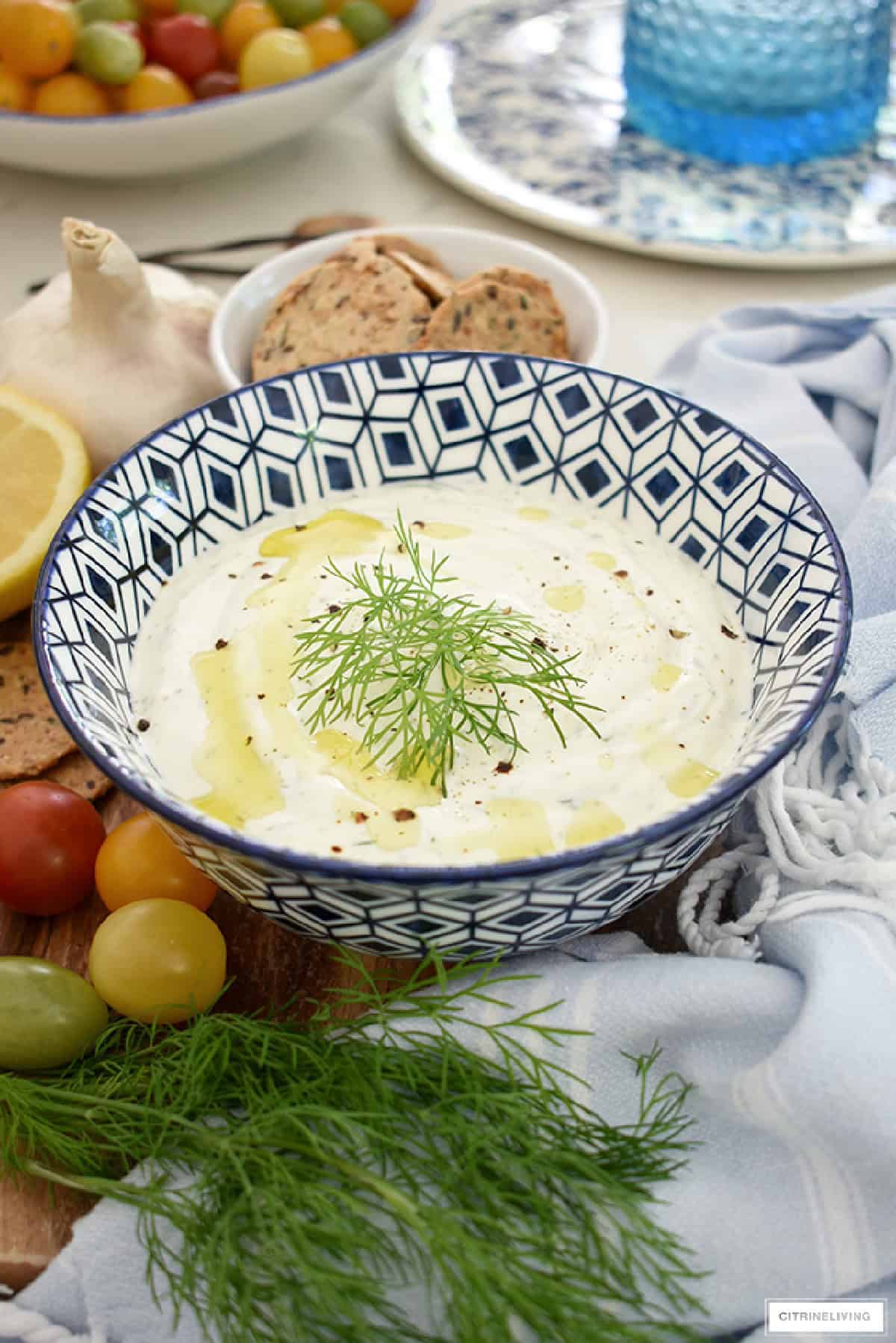 dill greek yogurt dip in a blue and white serving bowl