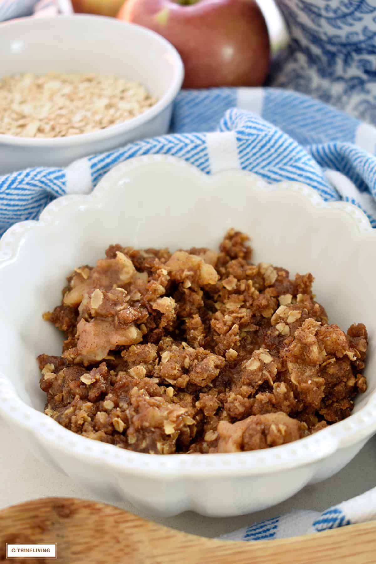 a white bowl filled with apple crisp
