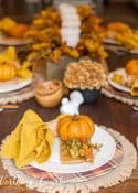 Pumpkin and fall-themed table setting with decorative accents for autumn decor.