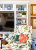 COLORful pattern arm chair in front of a white entertainment center