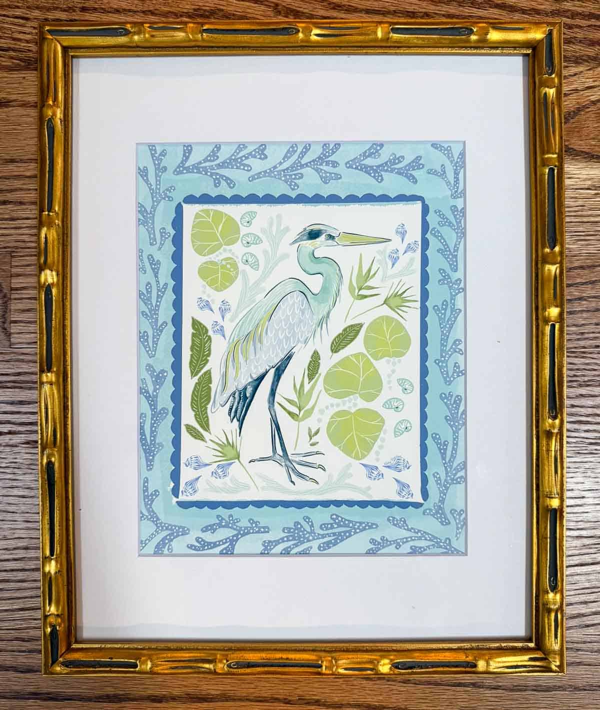 Elegant framed heron artwork featuring nature-inspired details, perfect for home decor.