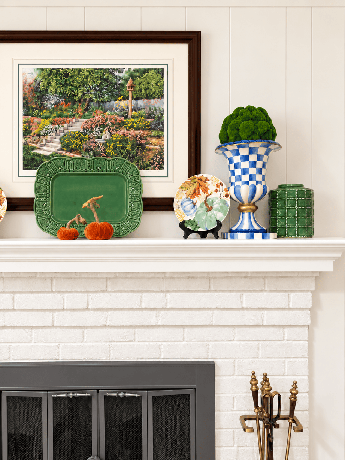 mantel with blue, white, and green fall decorations