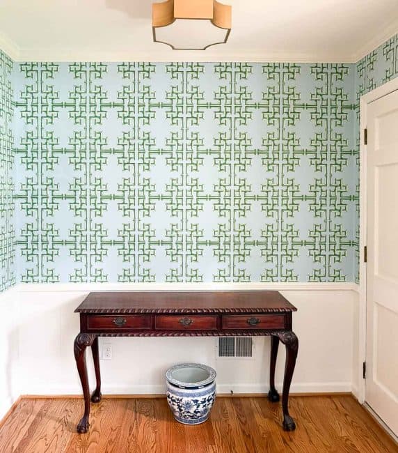 blue and green lattice wallpaper in a foyer