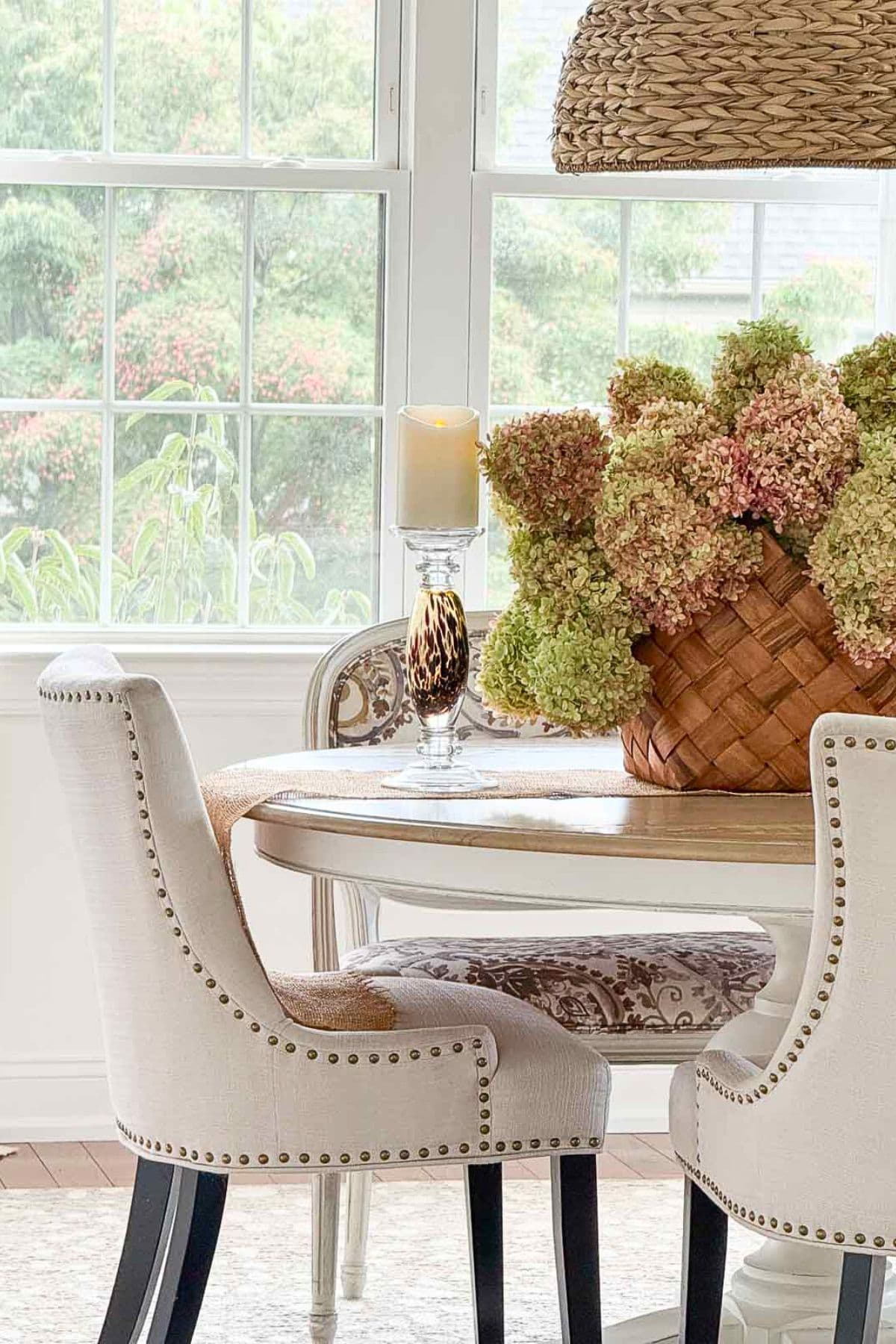 basket of dried limelight hydrangeas on a round dining table