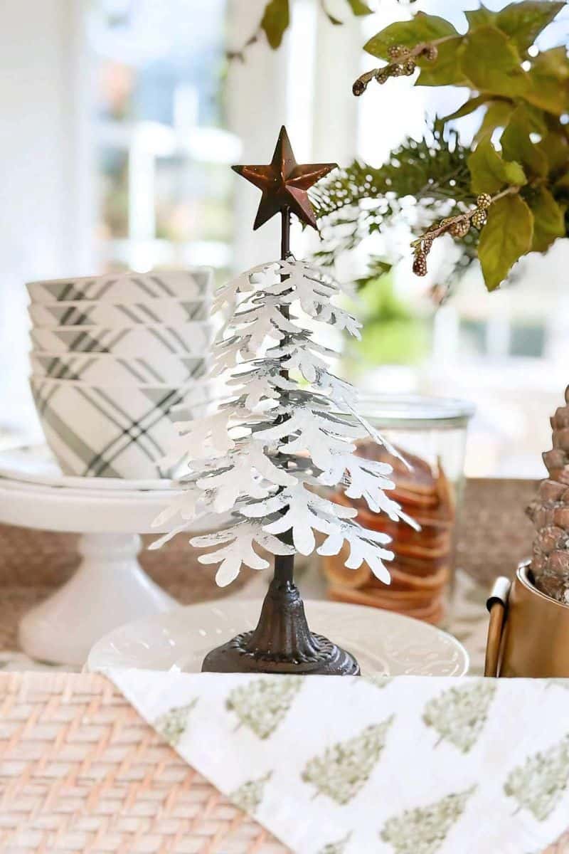 small white metal Christmas tree as part of a tablescape