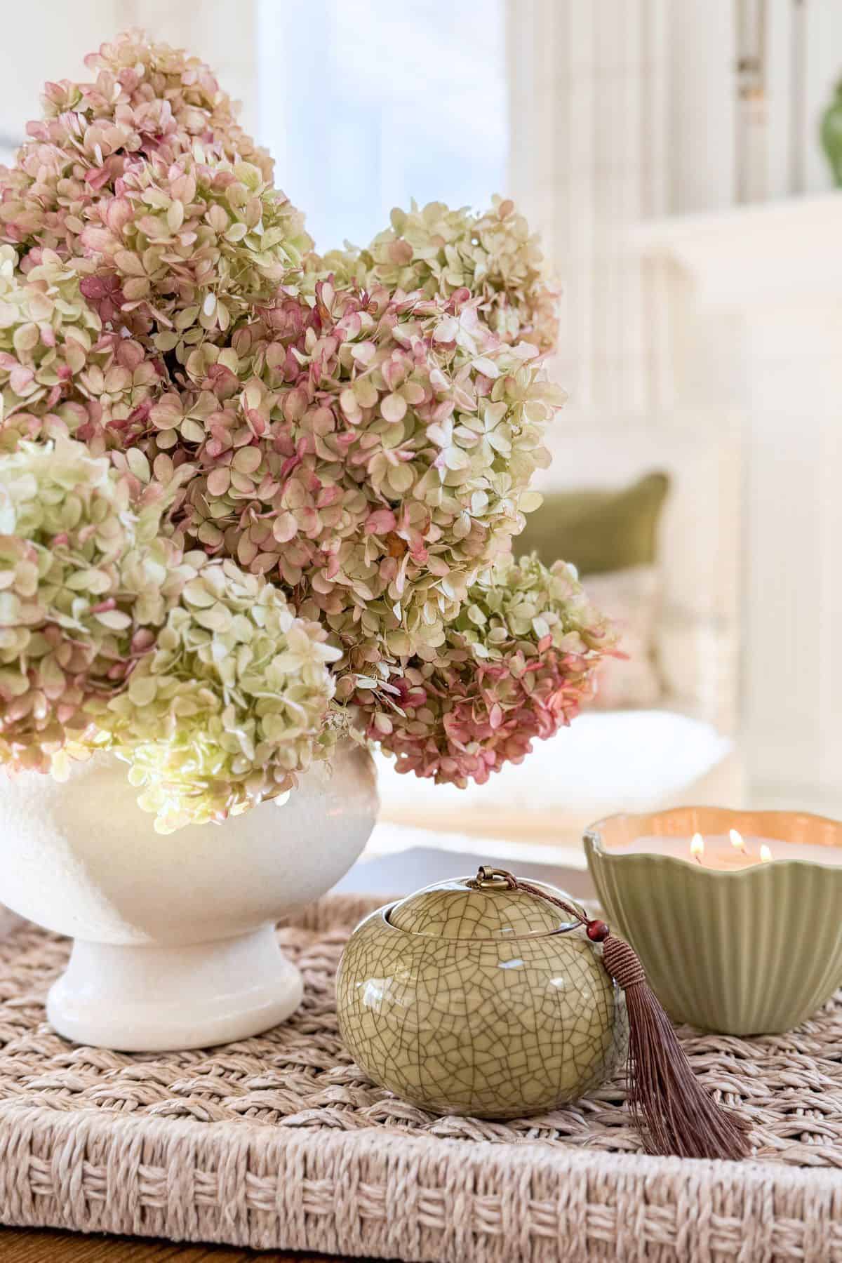 dried hydrangeas in a white vase