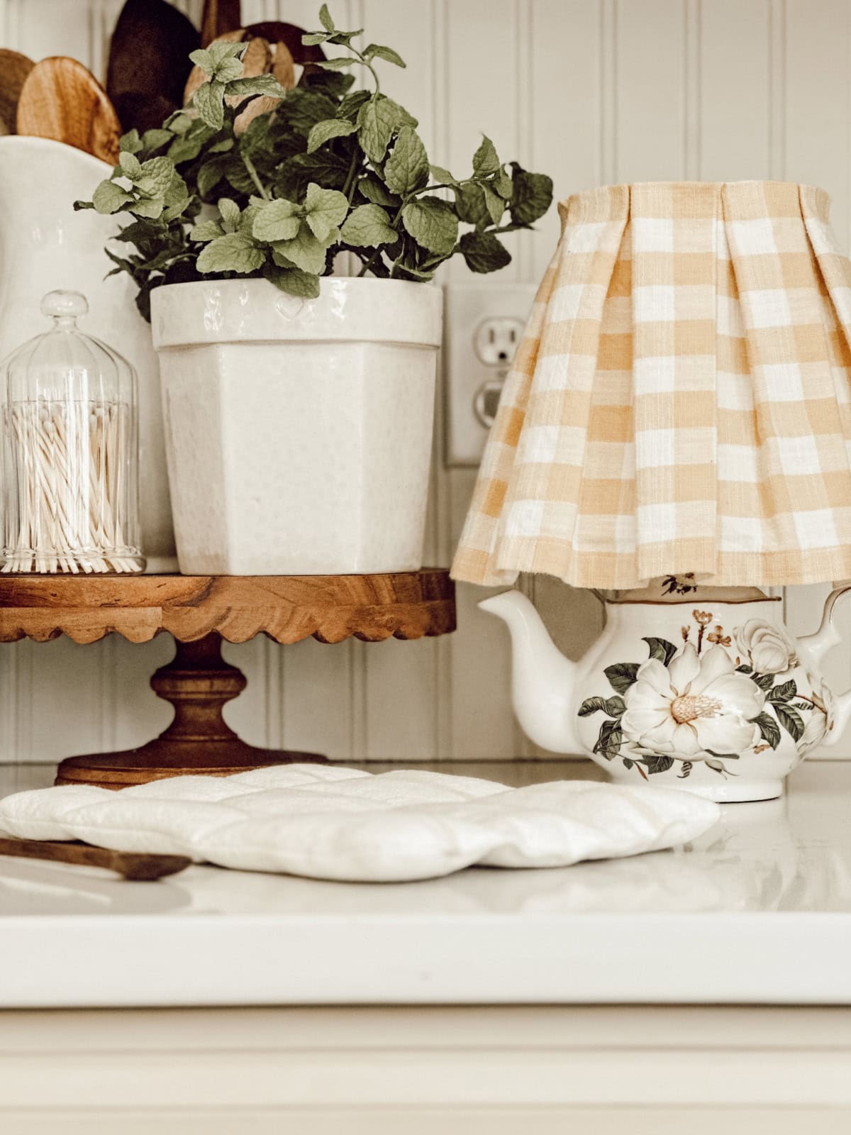 cute teapot lamp in a kitchen counter vignette