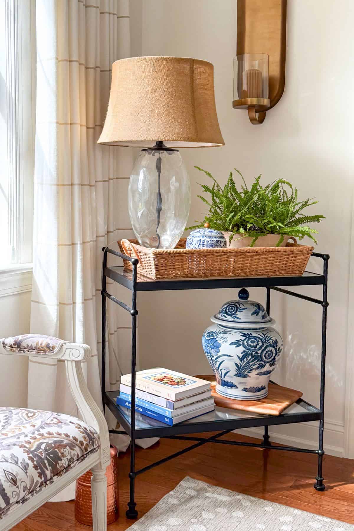 black metal side table filed with pottery barn style accessories