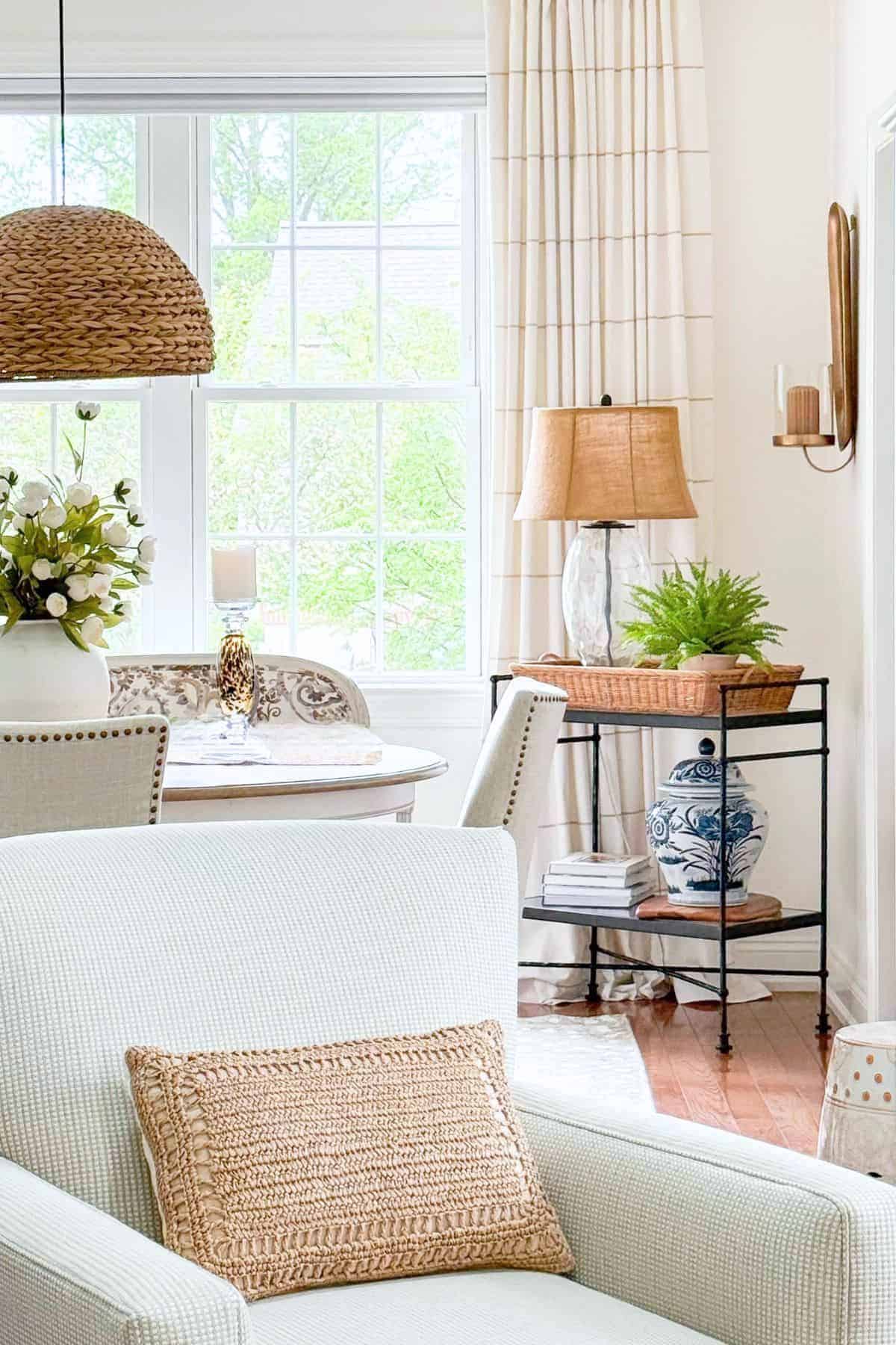 view into the corner of a room with neutral furnishings