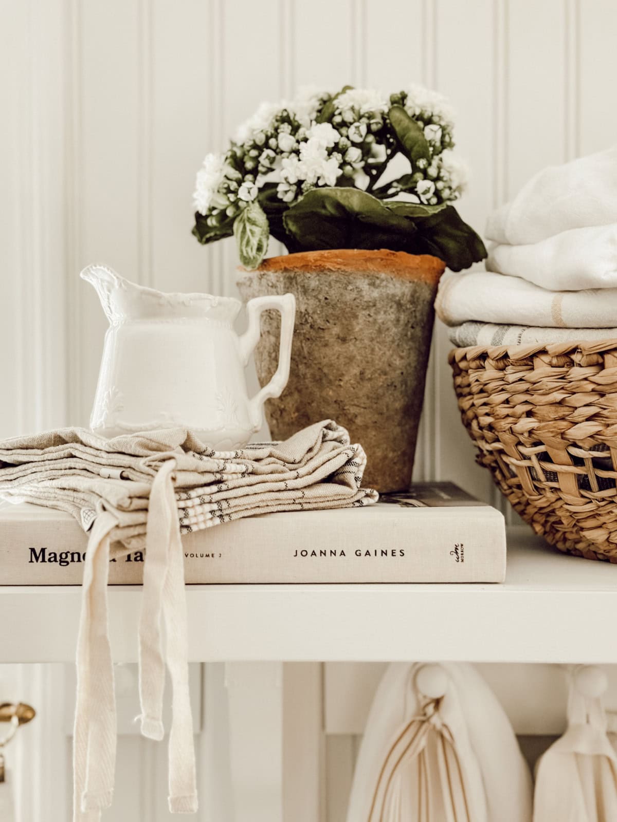 vintage white accessories in a vignette