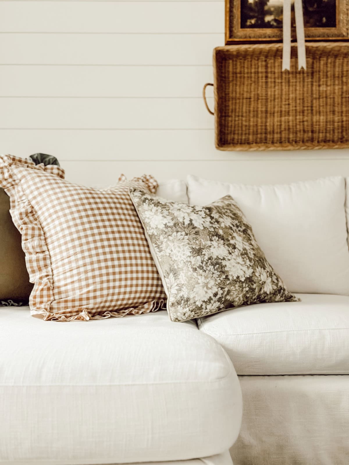neutral throw pillows on a white couch