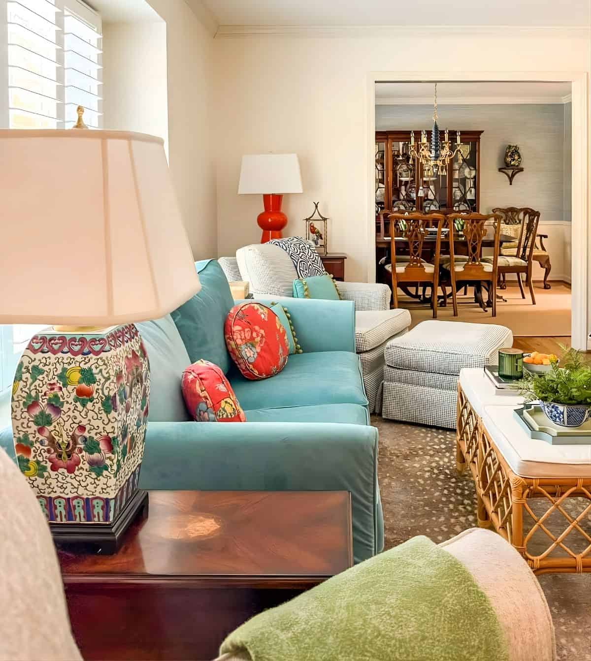 blue loveseat along with other furniture in a traditionally style living room