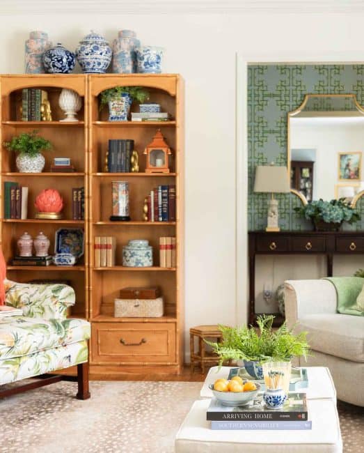 view of bookcases filled with chinoiserie accessories in a living room