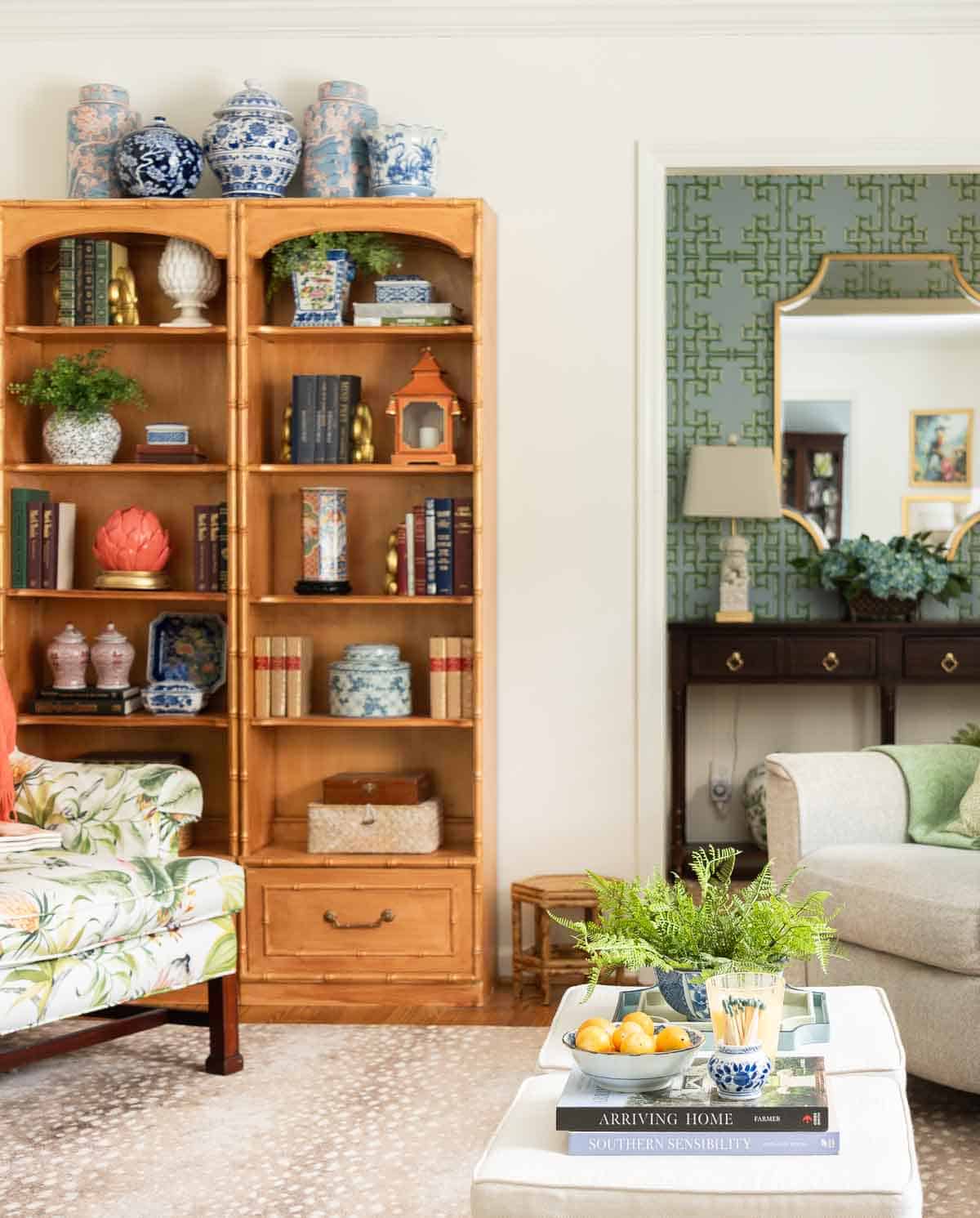 view of bookcases filled with chinoiserie accessories in a living room