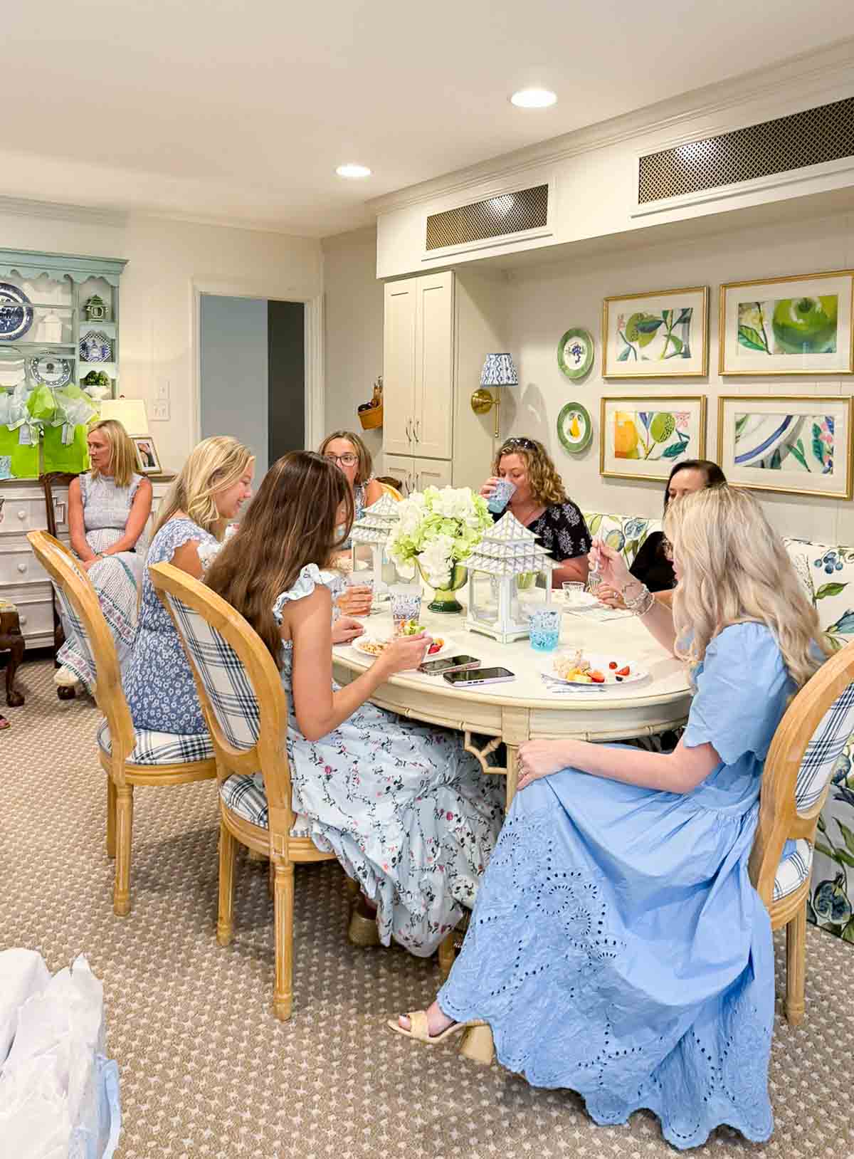 banquette table filled with young ladies at a bridal shower