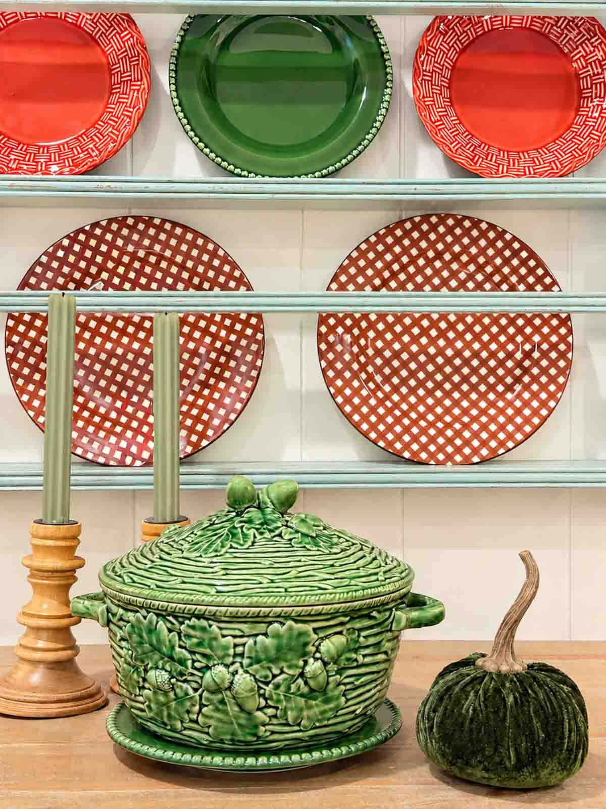 fall colored dishes in a plate rack and in a fall vignette