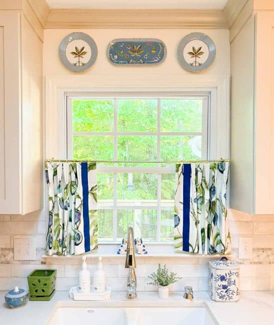 window above kitchen sink with colorful cafe curtains