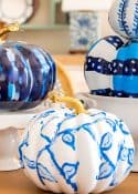 blue and white DIY painted pumpkins used as a centerpiece
